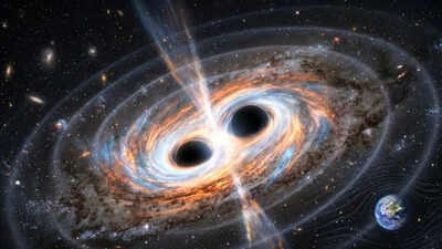Two giant black holes are set to collide in the next 100 years, and Earth could feel the shockwaves |