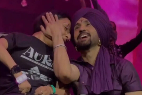 Diljit Dosanjh's heartwarming moment with a fan wins the internet as he sings 'Hass Hass' live for her - Watch | Hindi Movie News