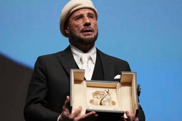 John Travolta tears up over honorary Palme d'Or at Cannes Film Festival; makes directorial debut with 'Propeller One-Way Night Coach'
