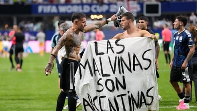 Argentina players display Falkland banner after World Cup win over England; in danger of facing FIFA sanctions