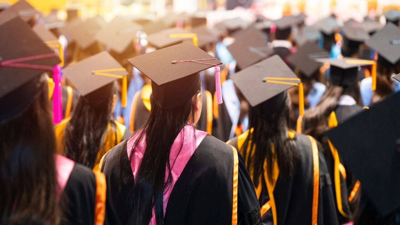 Why do graduates wear caps and gowns? The fascinating history behind the tradition and why the caps are tossed