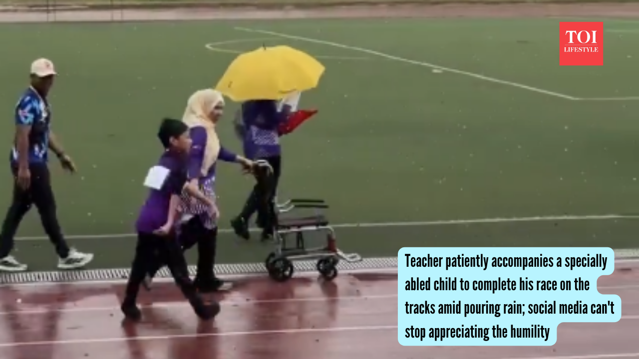 Teacher patiently accompanies a specially abled child to complete his race on the tracks amid pouring rain; social media can't stop appreciating the humility |
