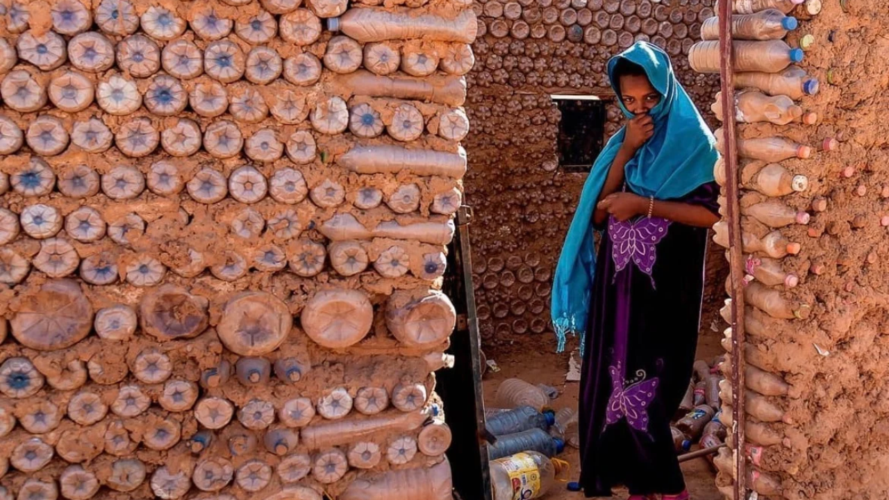 In 2016, A refugee engineer filled discarded bottles with sand to build his grandmother a safer desert home; the experiment expanded into 25 houses