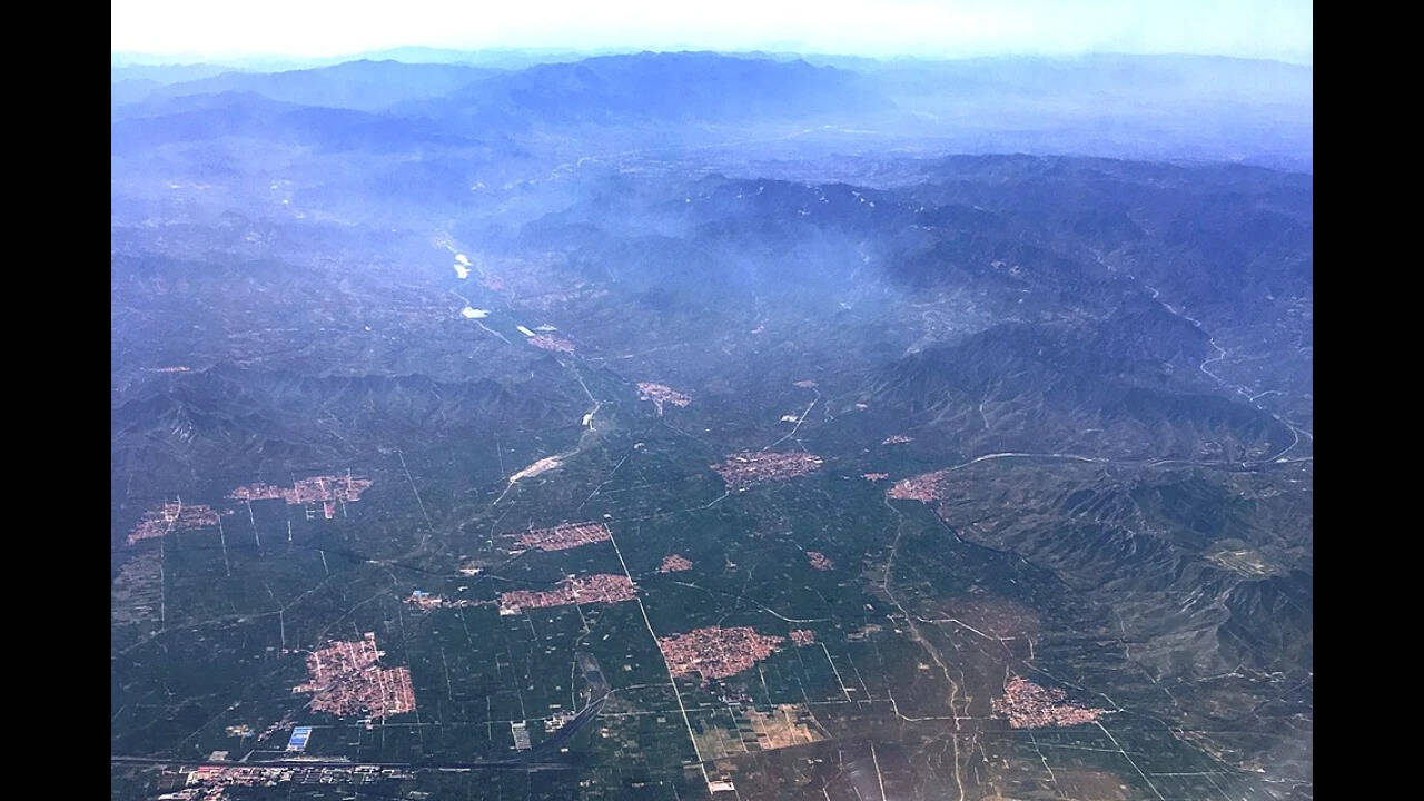 NASA images show more than 820 square kilometres of farmland transformed by the world’s largest cluster of plastic greenhouses