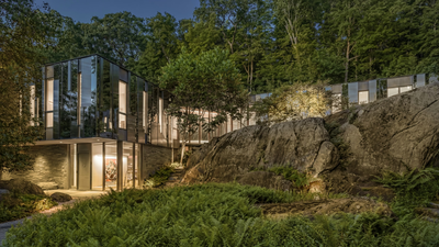 Built to reflect the trees around it, this 19.5-acre New York home almost disappears into the forest; the striking property is now on the market for $15 million |