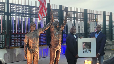 In 2001, two Seattle Mariners raised an American flag after clinching their division days after 9/11; 25 years later, that moment has become a permanent stadium statue