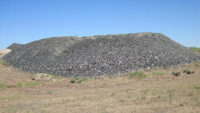 In 2002, Idaho buried nearly 300 tons of crushed waste glass beneath Highway 75; the material formed 8 to 12 inches of fill under a 200-foot road section