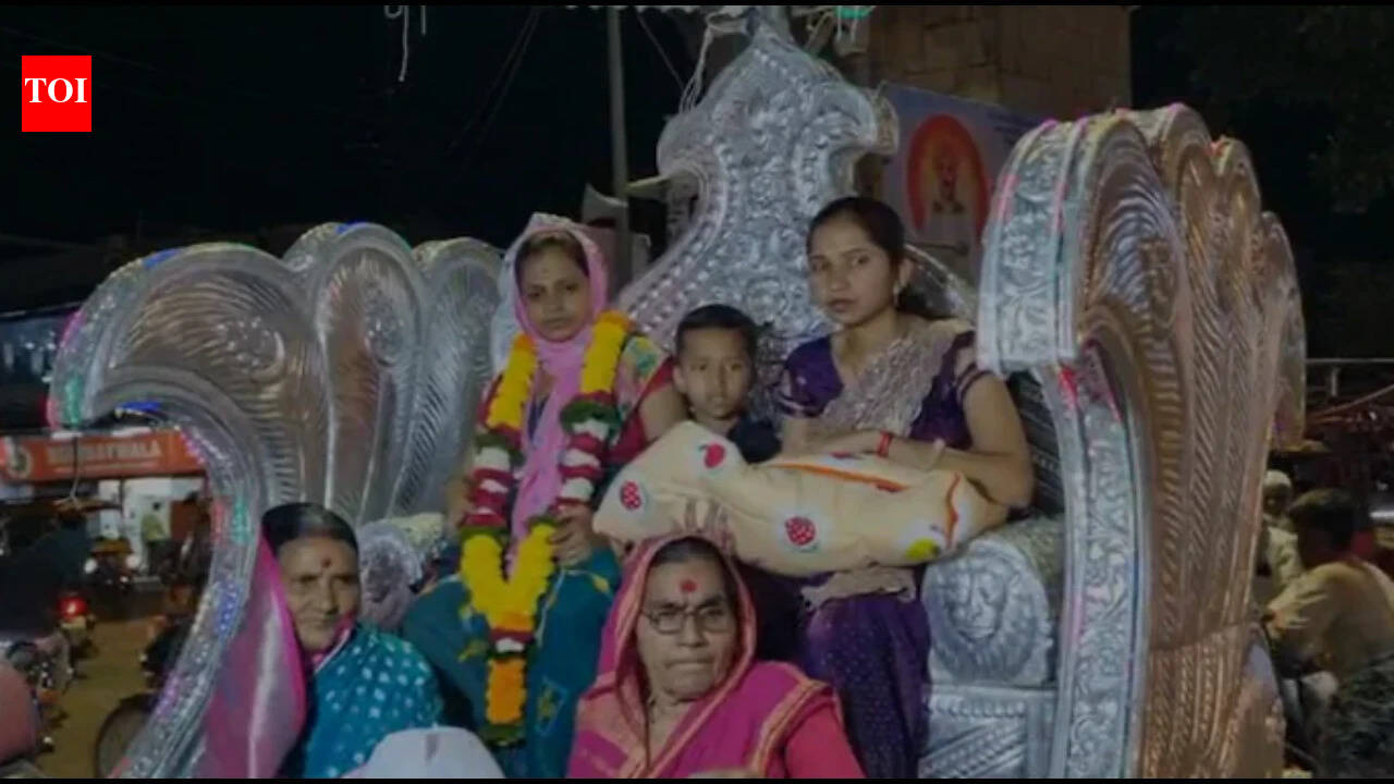 After 200 years, family welcomes a baby girl with a royal celebration in a golden chariot, with drum beats and vivid procession; grandmother calls her 'Laxmi Devi' |