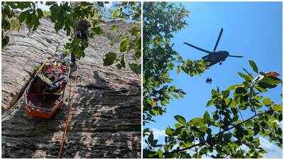 A climber fell 15 to 20 feet on a 350-foot North Carolina cliff; a rescuer ran 1.5 miles through a gorge carrying blood to keep him alive