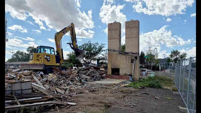Cheyenne's Twin Chimneys motor court stood for almost 90 years; this week its landmark chimneys fell in about 30 seconds to make way for a drive-thru coffee shop
